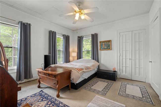 Bedroom with a ceiling fan | Image 20