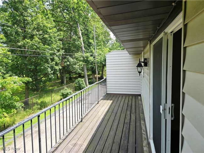 Deck with view of scattered trees | Image 5