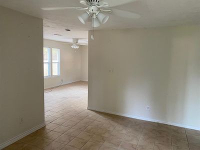 Living room looking into dining area. | Image 3