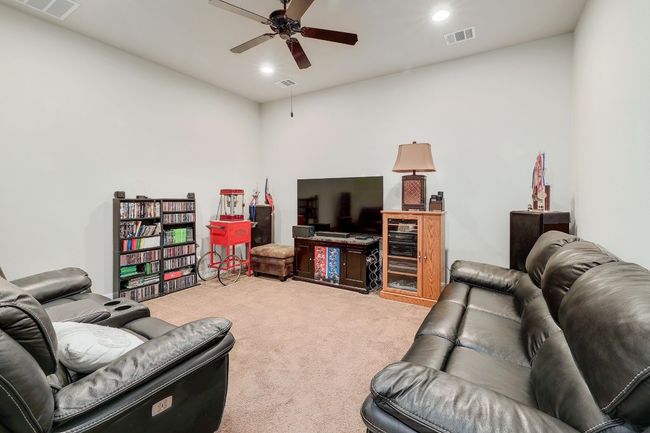 Carpeted living area with recessed lighting and ceiling fan | Image 23