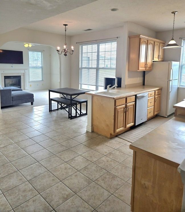 An eating area is located off the kitchen and flows into the living room for an open concept floorplan. | Image 4