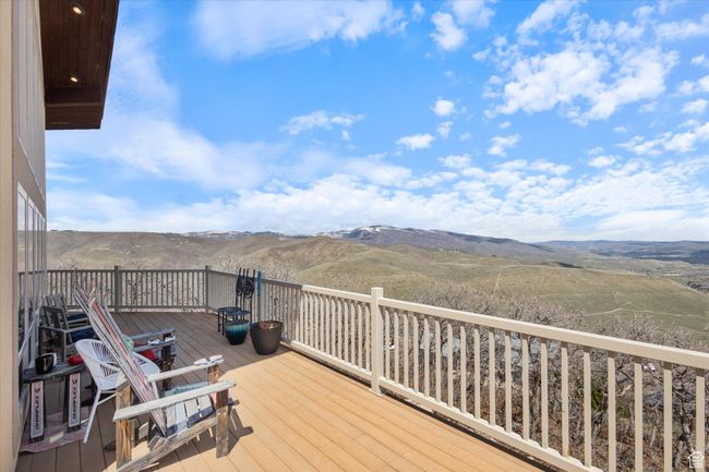 Wooden deck featuring a mountain view | Image 20