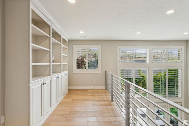 Corridor featuring light wood-style flooring and recessed lighting | Image 36