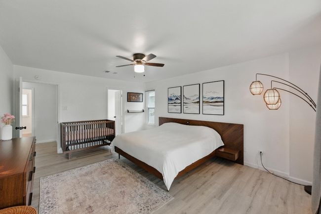 The spacious primary suite offers a serene retreat, complete with a walk-in closet for ample storage. | Image 14