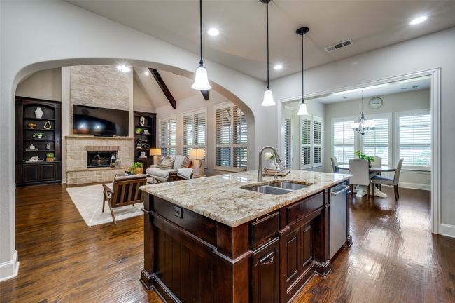 The open floor plan is ideal for entertaining, effortlessly flowing from one space to the next, creating a welcoming atmosphere for family and friends. | Image 13