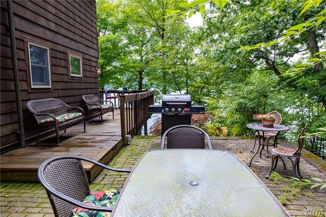 Patio wraps around the first level of the house. | Image 31