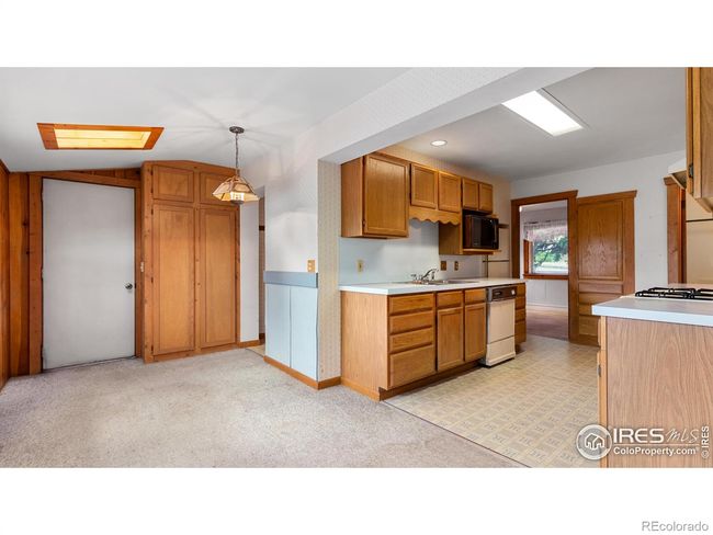 Dining area open to kitchen | Image 13