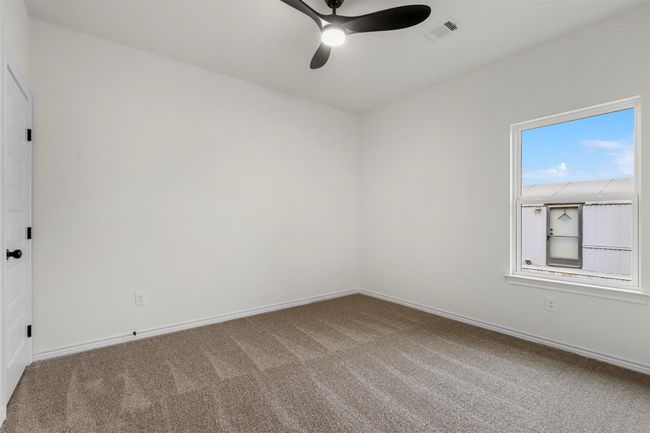 Spare room with ceiling fan and carpet | Image 26