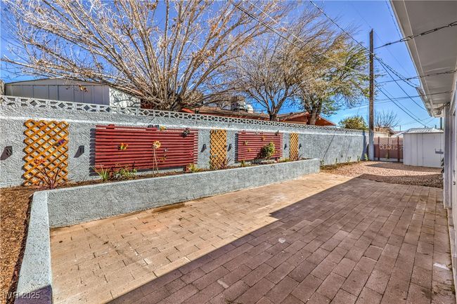 View of patio with a shed, an outdoor structure, and fence private yard | Image 35