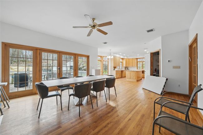 Dining room with recessed lighting, light wood-type flooring, visible vents, and ceiling fan with notable chandelier | Image 9