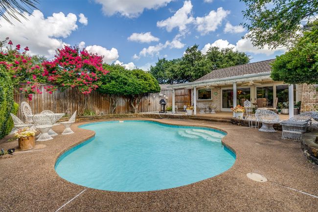 View of pool with a patio area and a fenced backyard | Image 22