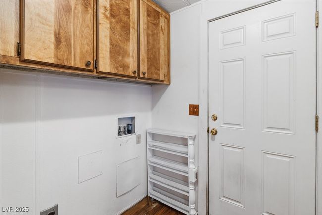 Washroom featuring cabinet space and washer hookup | Image 26