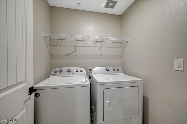 Laundry area with washer and clothes dryer | Image 50