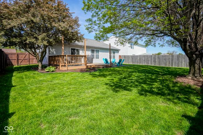 view of yard with a wooden deck and a fenced backyard | Image 36