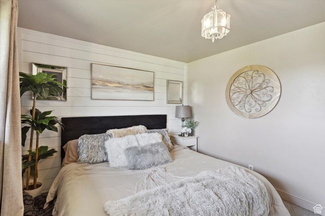 Bedroom with a chandelier | Image 13