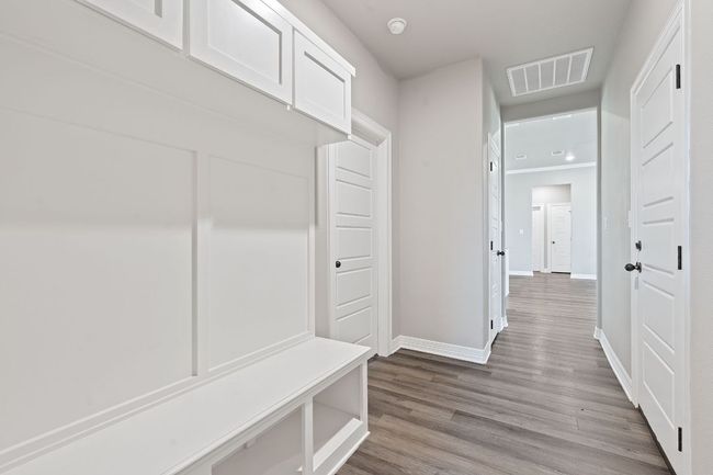 Mudroom with baseboards and wood finished floors | Image 24