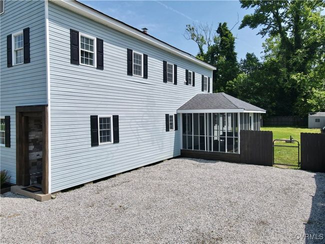 Double width off street gravel parking with easy direct access to front entry or screen porch entry | Image 35