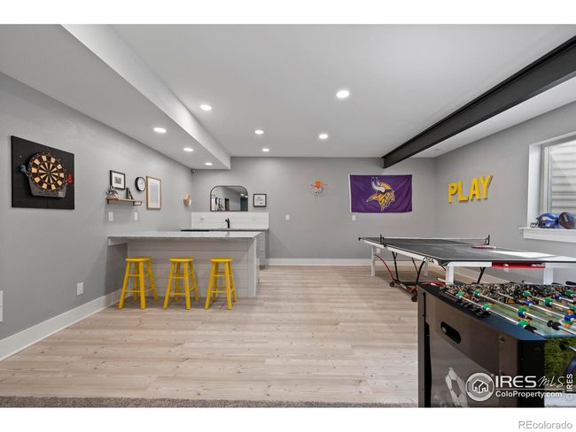 Game room with a wet bar | Image 24