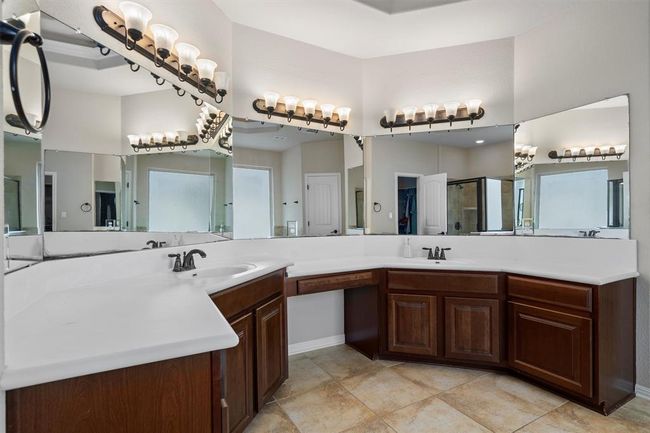 Full bath featuring vanity, a shower stall, and tile patterned flooring | Image 23