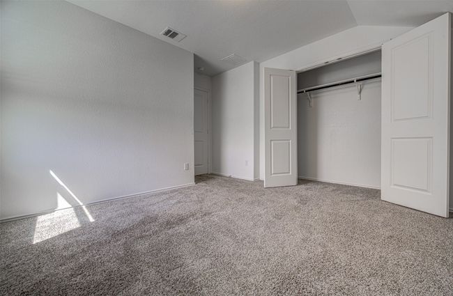 Unfurnished bedroom featuring carpet flooring and a closet | Image 26