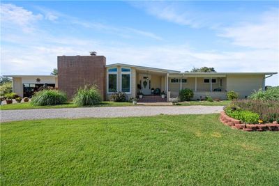 View of front of home with a porch and a front yard | Image 1