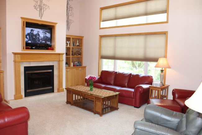 Spacious living room with lots of natural light. | Image 49