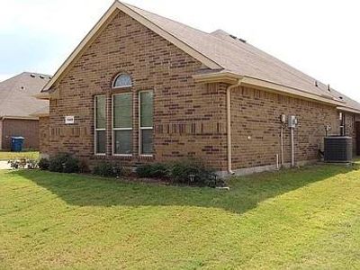 View of side of home with central AC unit and a yard | Image 3