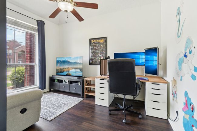 Home office with wood finished floors and ceiling fan | Image 25