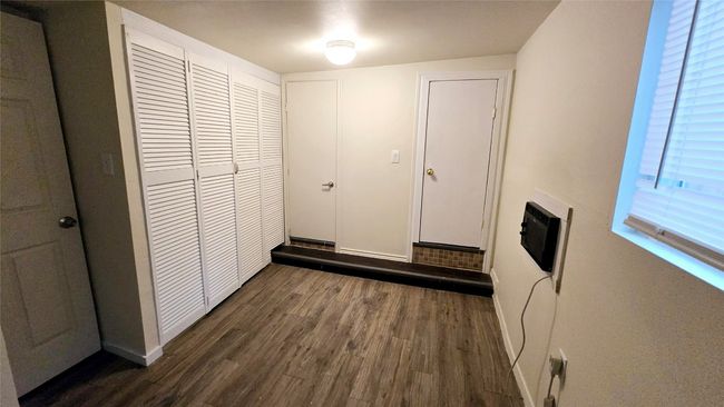 Hall with baseboards and dark wood-style flooring | Image 38