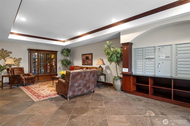 Lobby of building with mailboxes. | Image 25