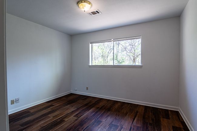 1214 Hunt - Bedroom with laminate floor | Image 12