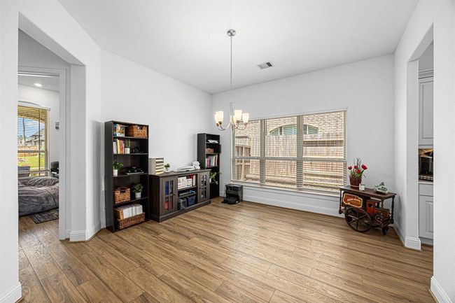 Formal dining area off the entry of the home with convenient access to the kitchen with space for a large dining table! | Image 12