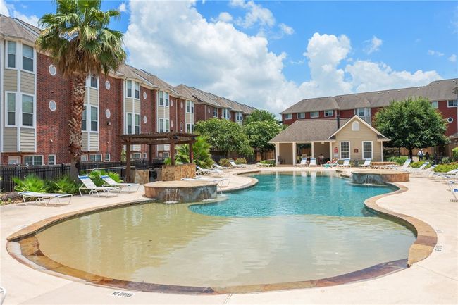 Community pool featuring a pergola, a patio area, a jacuzzi, and a residential view | Image 18