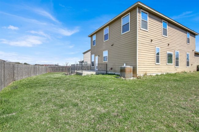 Back of house featuring a lawn, a fenced backyard, and central air condition unit | Image 34