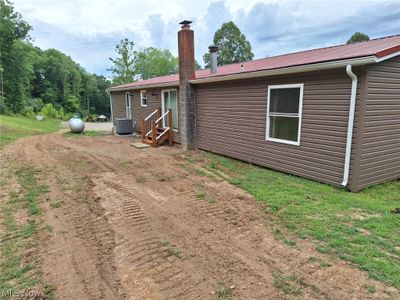 Rear view of house featuring central air condition unit | Image 2