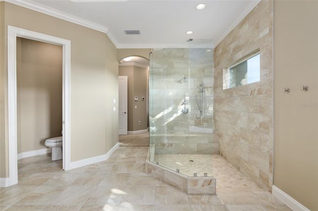 Separate water closet and full view of shower | Image 51