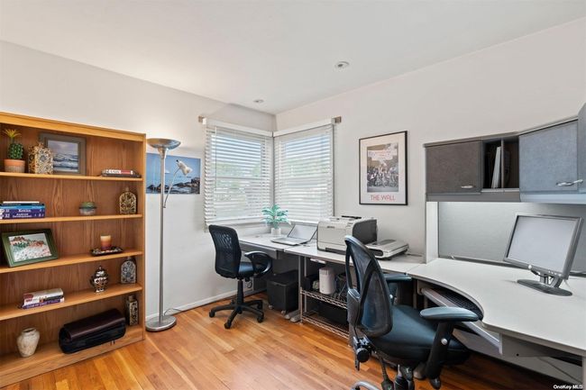 1st floor bedroom with wood floors (used as office) | Image 11