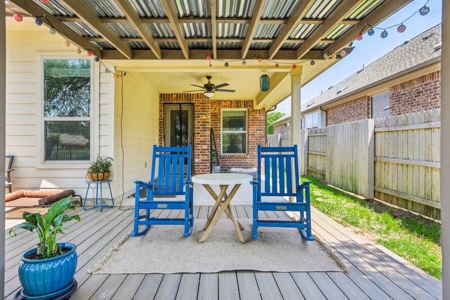 Wooden terrace featuring a ceiling fan | Image 30