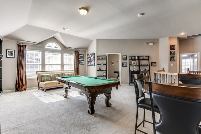 Recreation room featuring light carpet, lofted ceiling, and billiards | Image 32