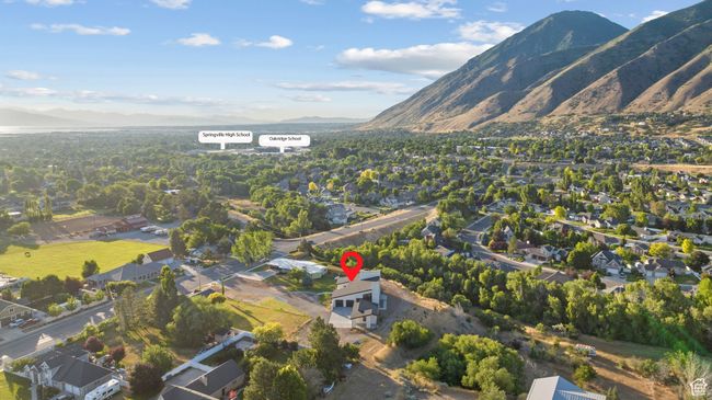 Aerial view of property's location featuring a mountainous background and nearby suburban area | Image 102