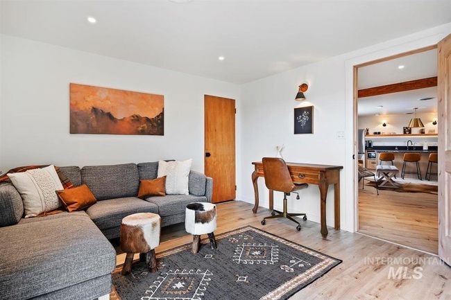 Living area with light wood-style flooring and recessed lighting | Image 42