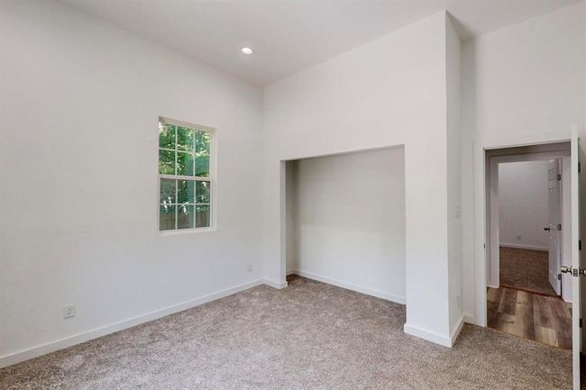 Unfurnished bedroom featuring wood-type flooring | Image 22