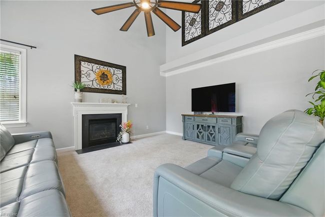 Family Room/Den with gas fireplace is located at the rear-right of the home... | Image 5