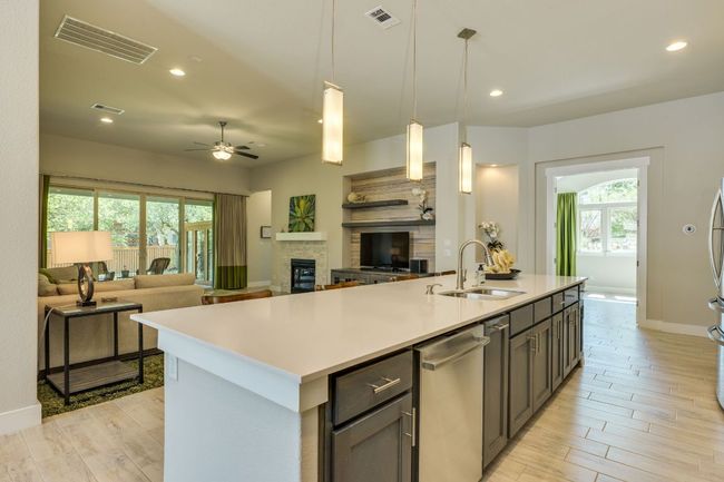 Kitchen island opens to living area | Image 15