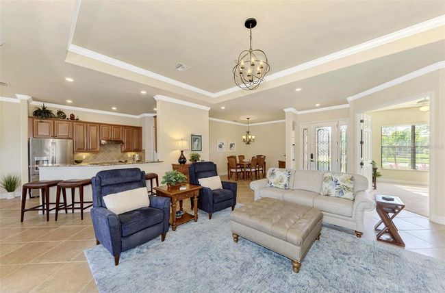 Great Room with Tray Ceiling and Crown Molding w/Tile Floors | Image 20