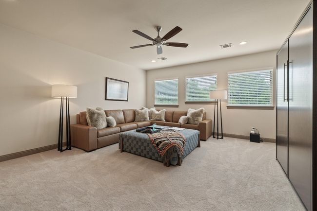 Living room featuring light colored carpet, ceiling fan, baseboards, and recessed lighting | Image 23