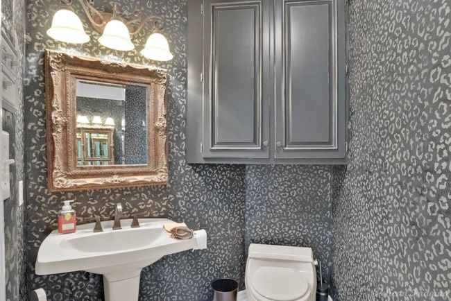Half bath featuring toilet and wallpapered walls | Image 4
