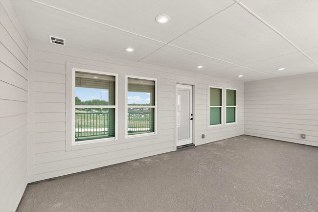 Property entrance with a patio area | Image 33