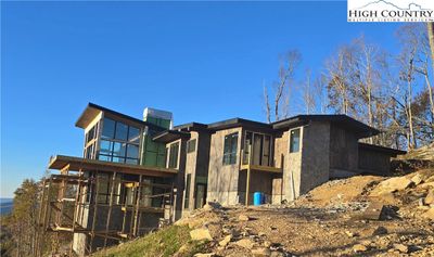 Front Right View with Large 2 Story Family Room Custom Windows | Image 1