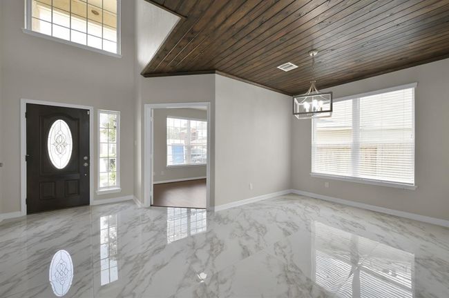 Foyer view from inside. Front door on the left, Office straight, and Dining Room on the right. | Image 6